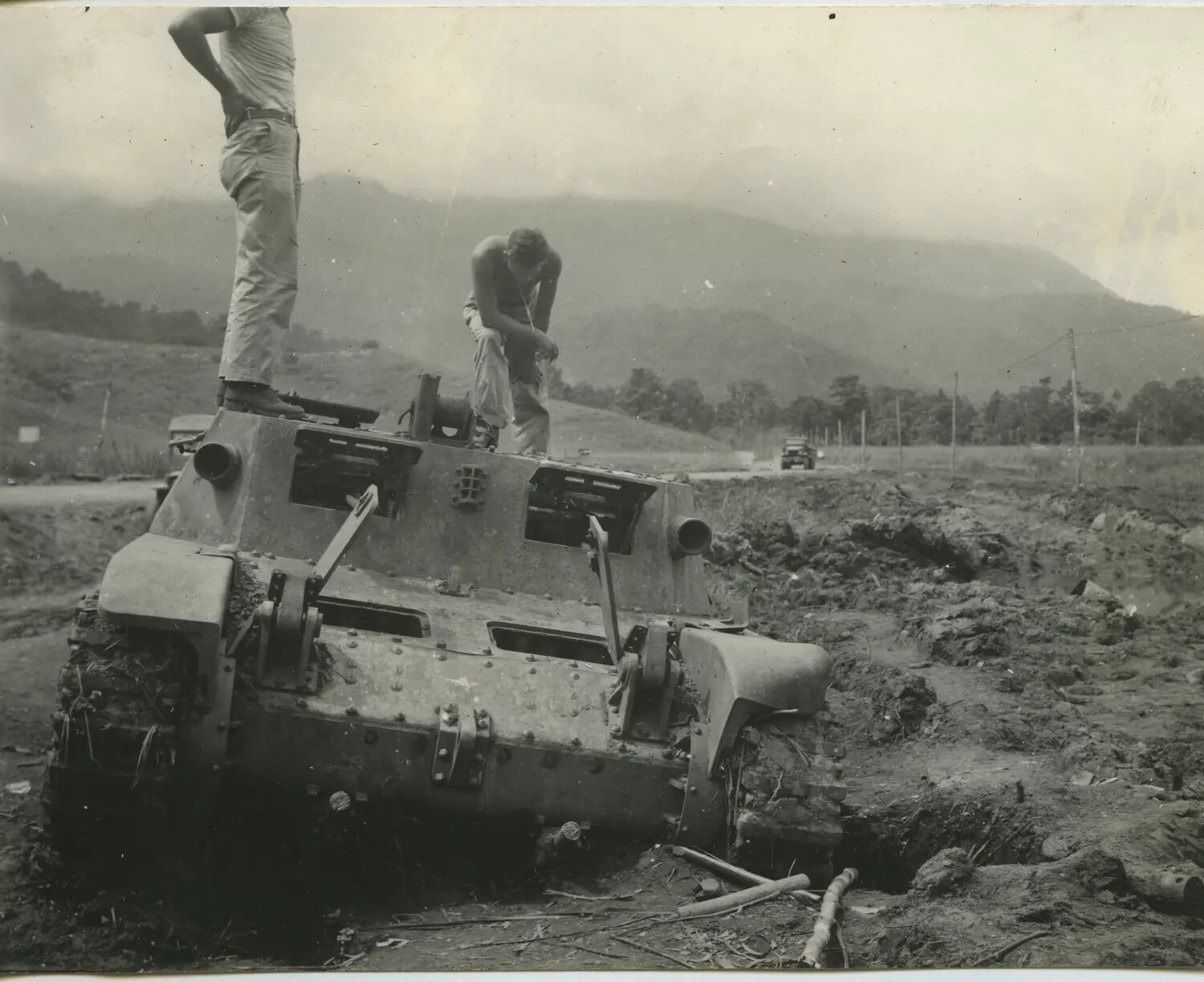 American Servicemen Inspect Wrecked Armored Vehicle, Southwest Pacific Theater