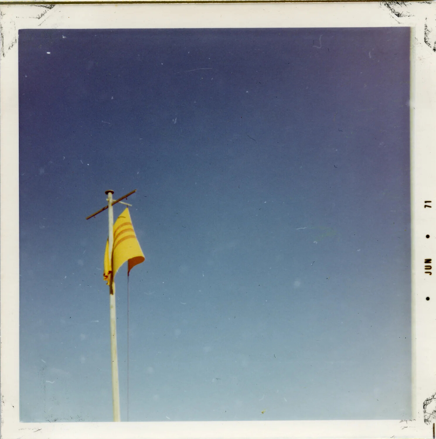 Flag of the Republic of Vietnam Flying Against Clear Sky, June 1971