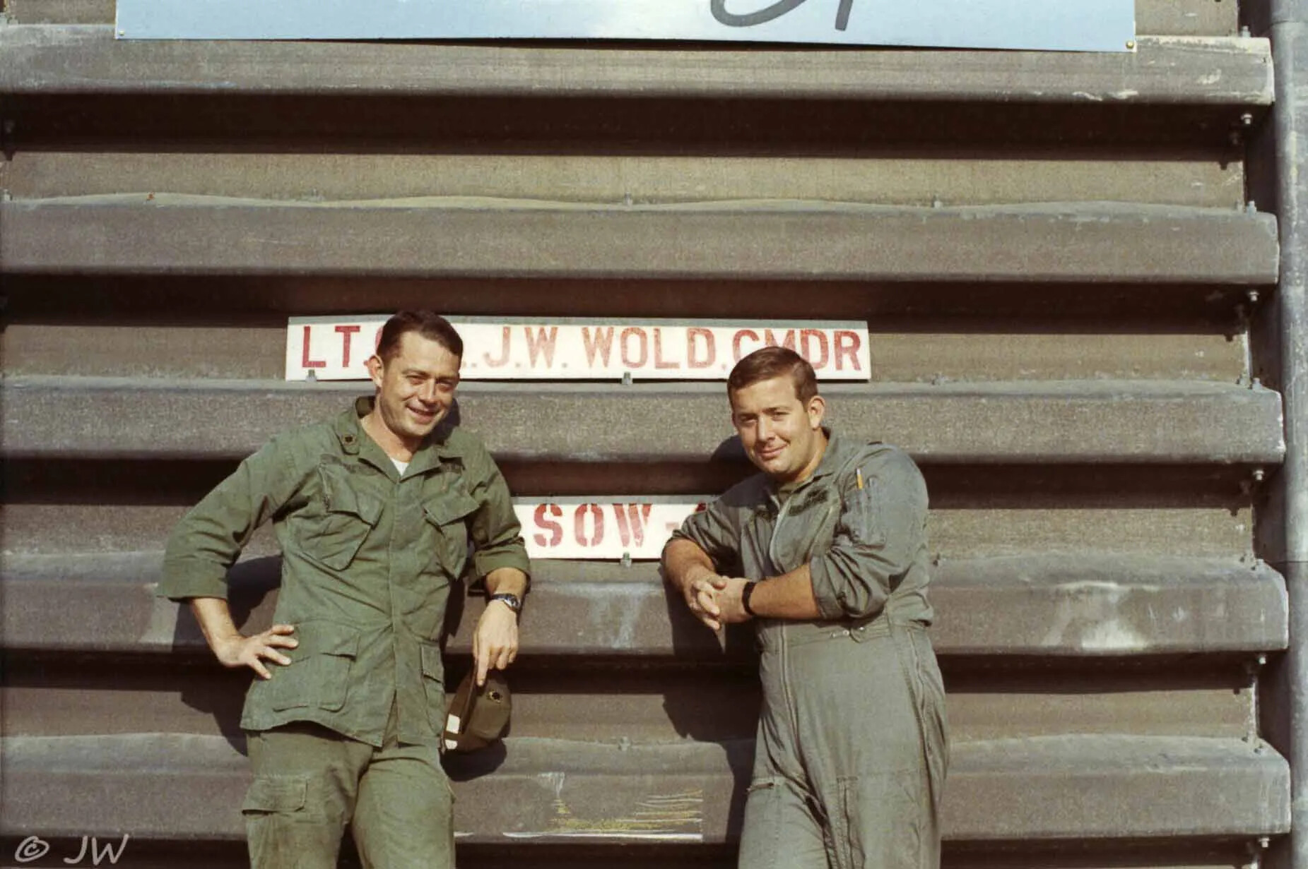 Two Airmen Posing Beside Squadron Commander's Sign, Special Operations Wing, Vietnam War Era