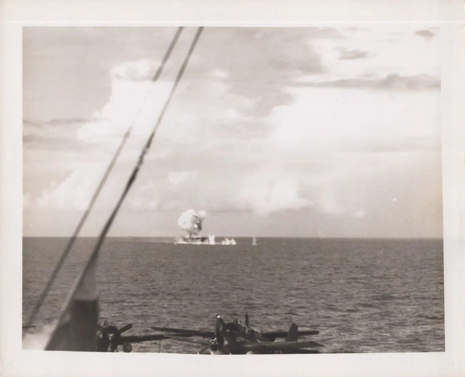Explosion Near Distant Ship, Photographed from USS Petrof Bay (CVE-80), October 1944