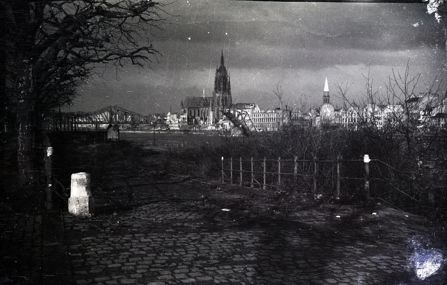 Ruined German City Skyline with Cathedral and Collapsed River Bridge, Postwar Period