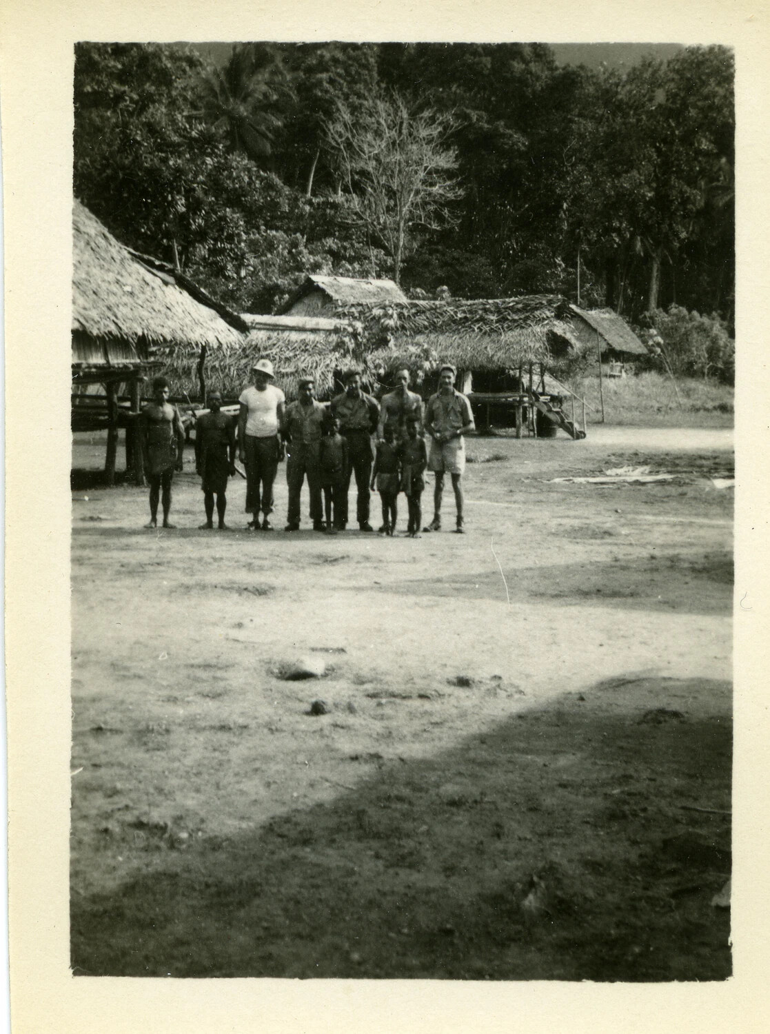 U.S. Servicemen Posing with Pacific Islander Villagers, South Pacific Theater, WWII