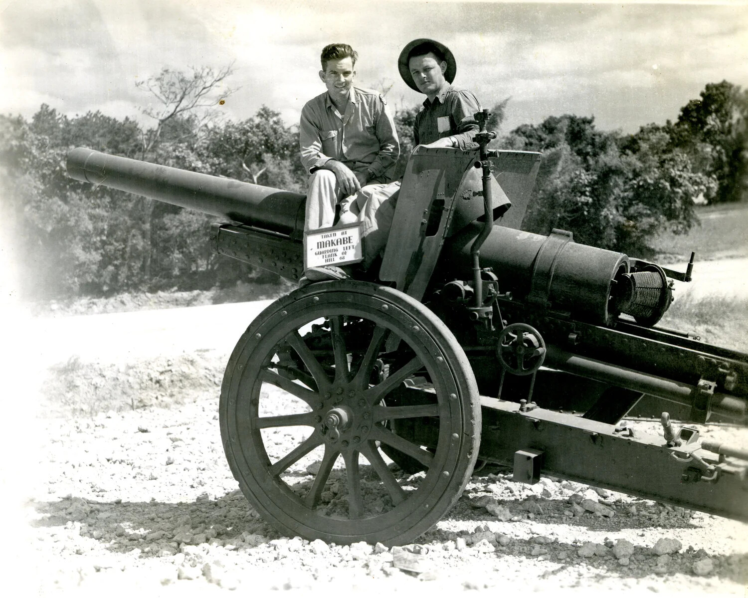 U.S. Servicemen Posed on a Captured Japanese Heavy Field Gun, Makabe, Okinawa, 1945