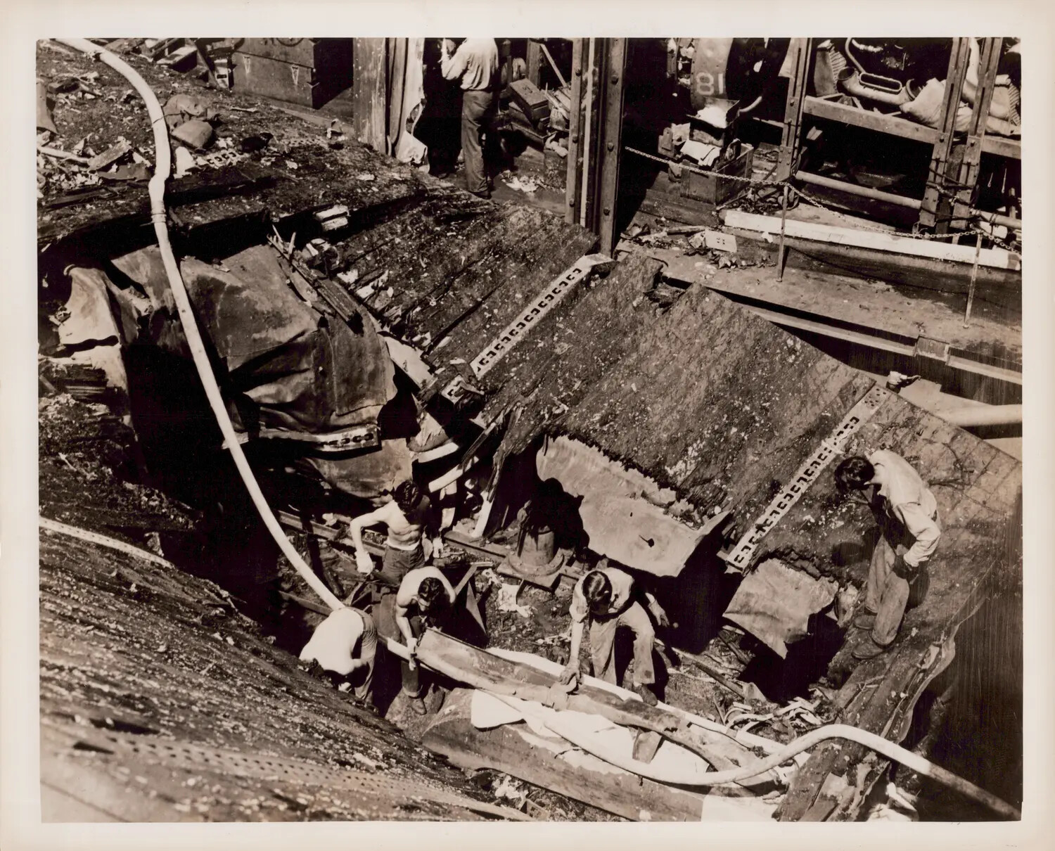 Battle Damage Aftermath - Torn Flight Deck and Hangar Structure, U.S. Navy Escort Carrier, WWII Pacific Theater