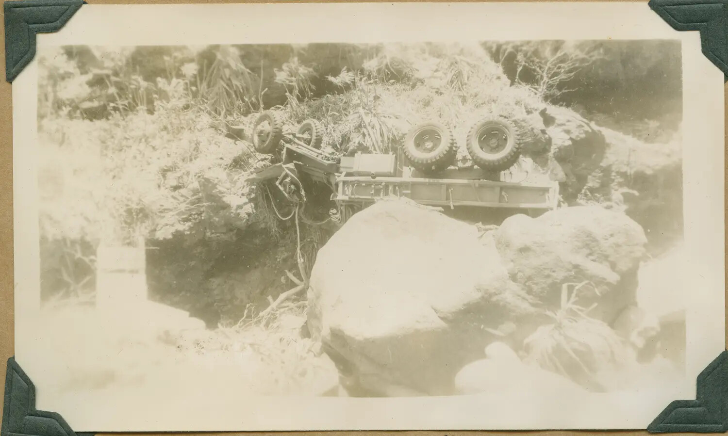 WWII Hawaii Photo Album: Overturned Military Truck Wreck Among Boulders