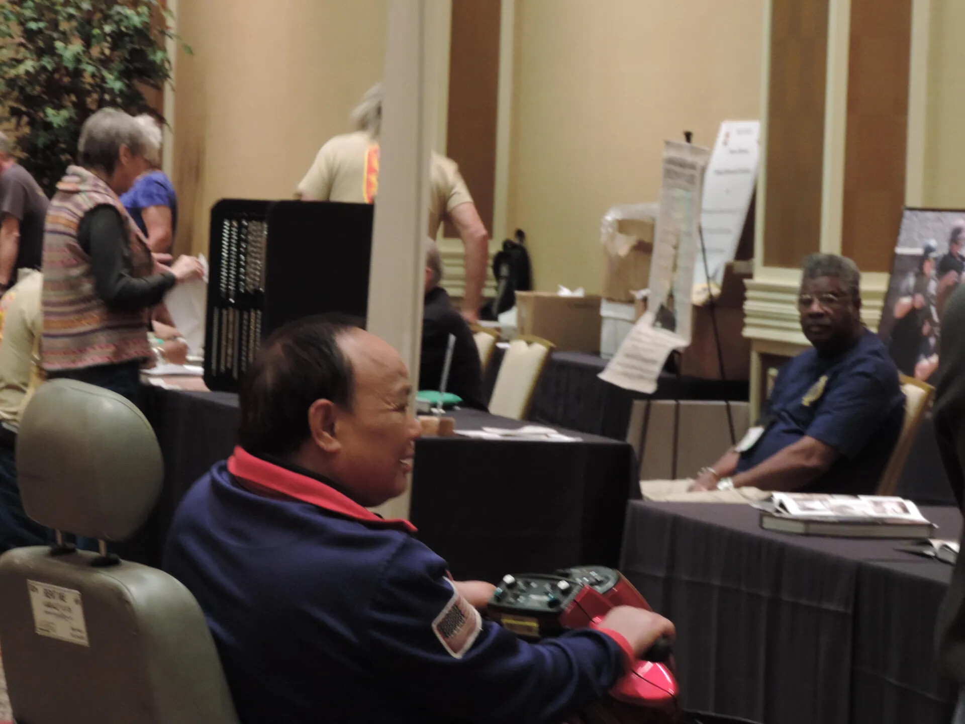 Attendee on a Mobility Scooter in the Display Hall, Special Operations Association Reunion, Las Vegas, 2013