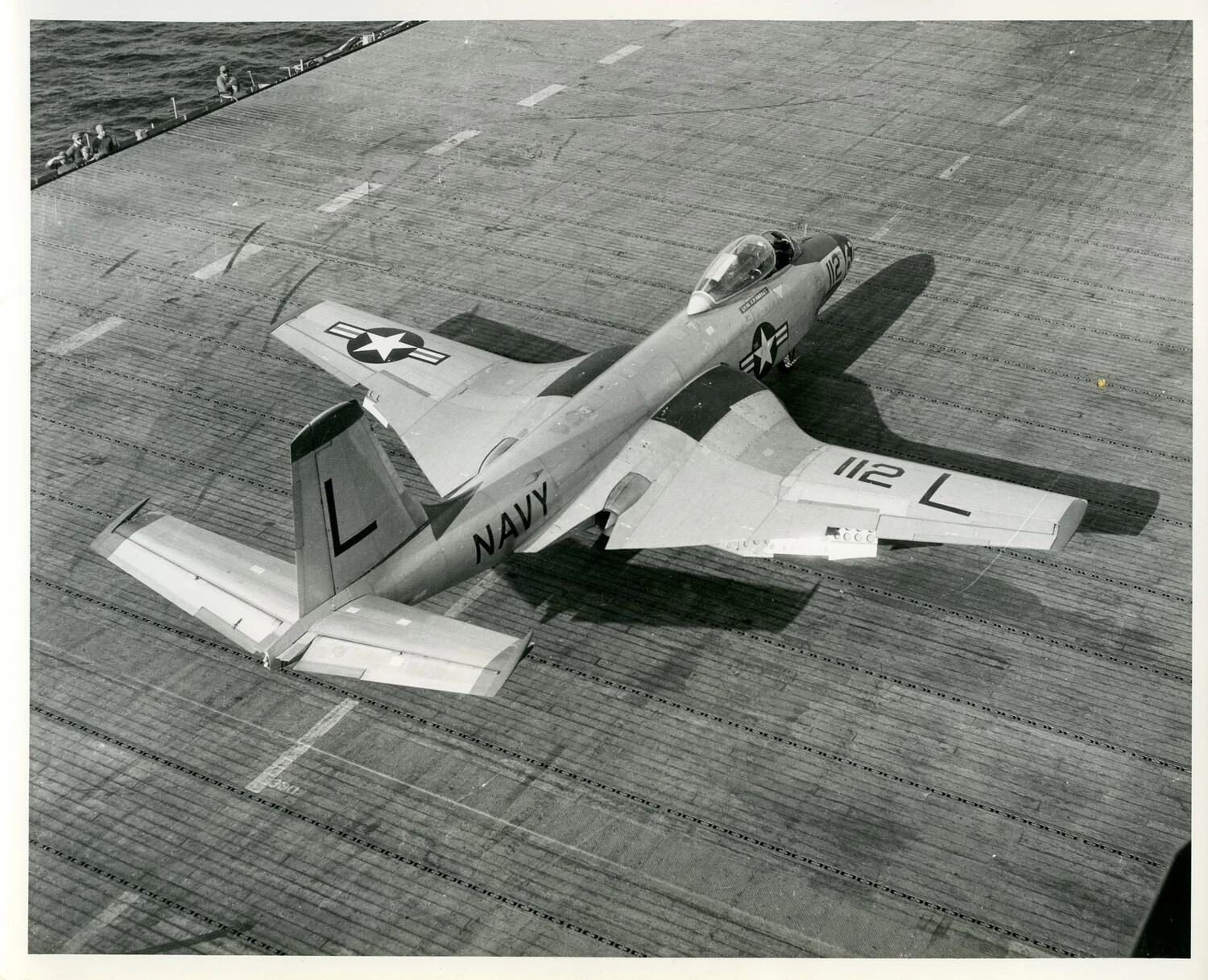 U.S. Navy Swept-Wing Jet Fighter "112 L" on Aircraft Carrier Flight Deck