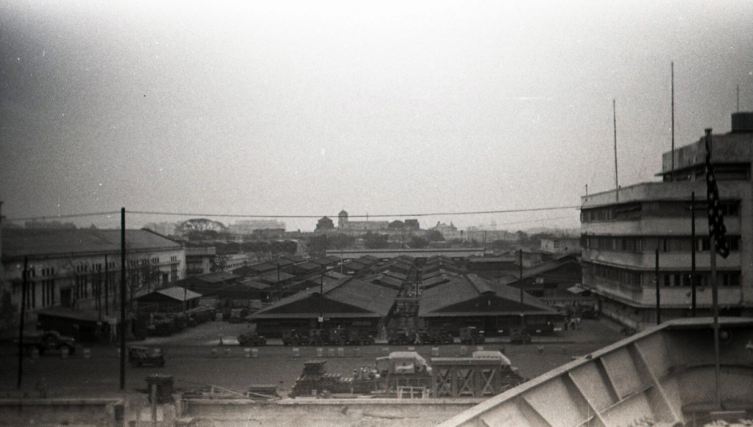 Elevated View of U.S. Army Motor Pool and Bombed Bridge Structure, Manila Port Area, Philippines, 1945