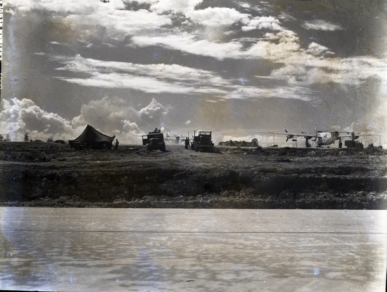 Airfield Encampment with Tents, Trucks, and B-25 Mitchell Dispersal Area, Ie Shima, WWII Pacific Theater