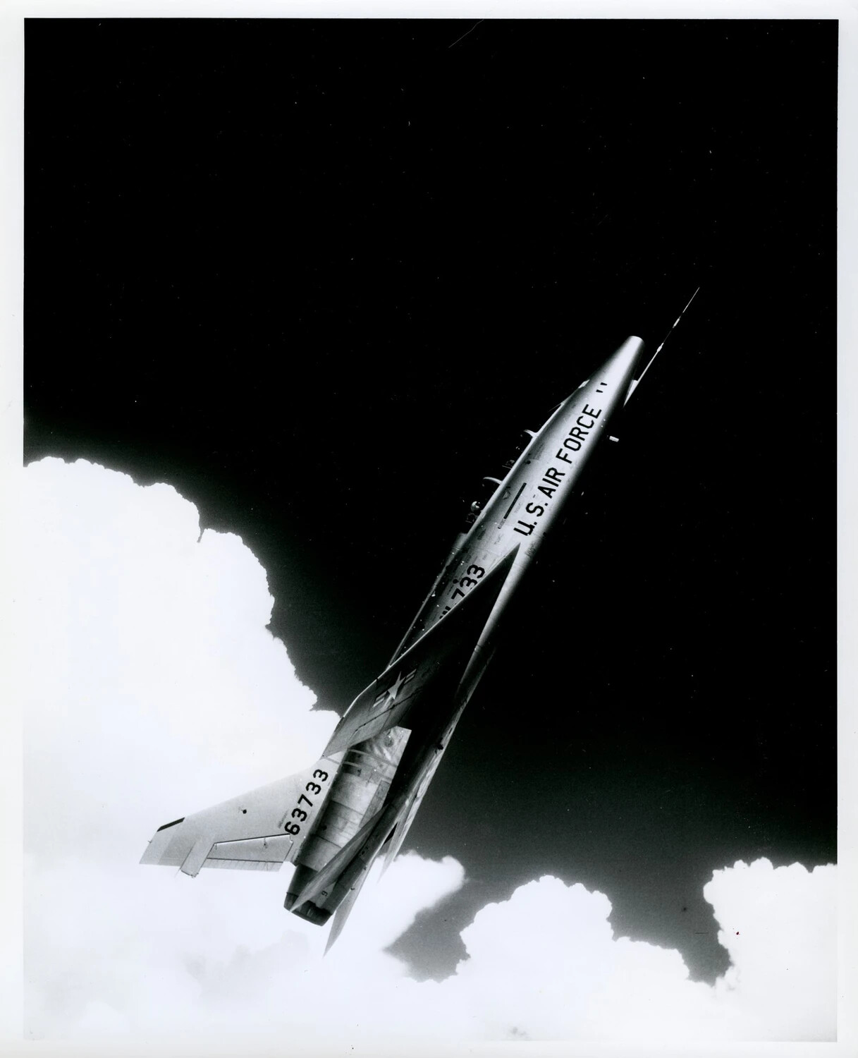 USAF Delta-Wing Interceptor Climbing Through Clouds