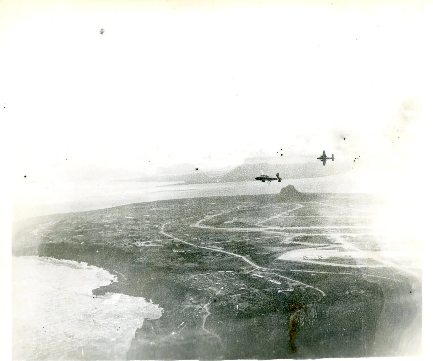 B-25 Mitchell Bombers in Formation Over Coastline During Strike Mission