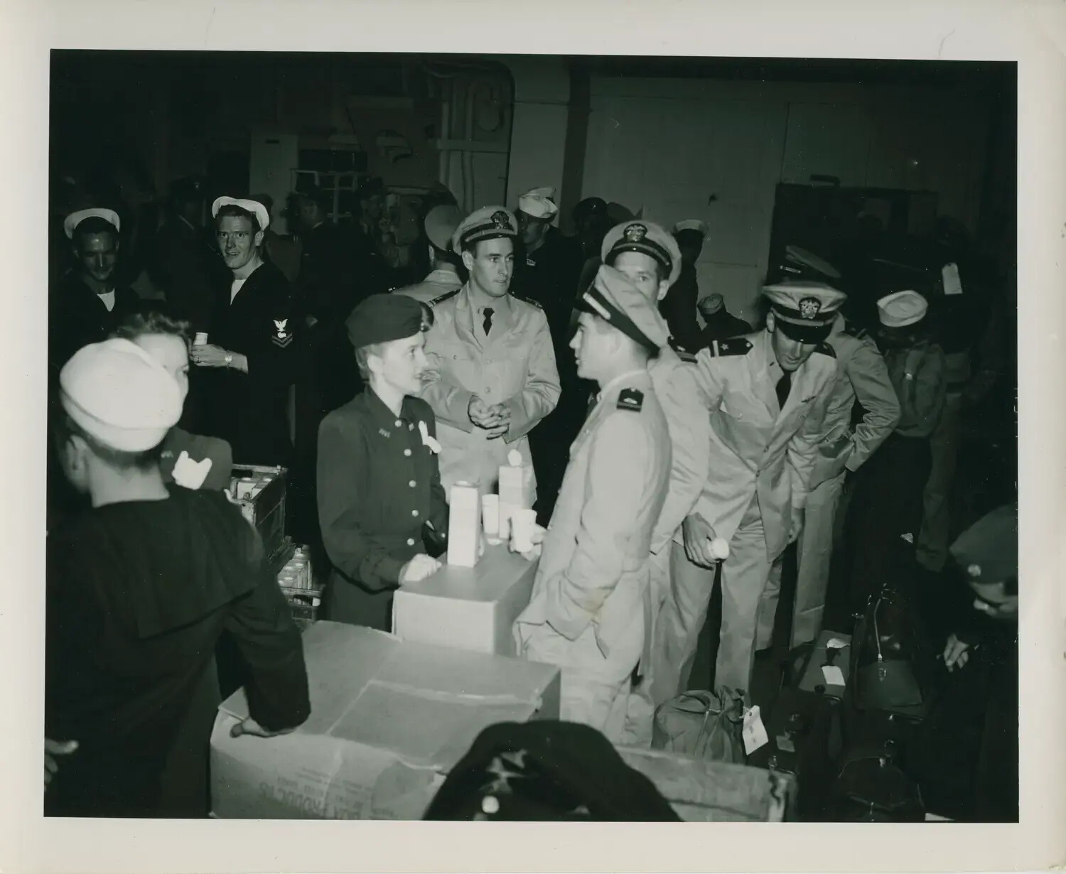 Officers and Crew Gathered at Shipboard Store, USS Petrof Bay (CVE-80)