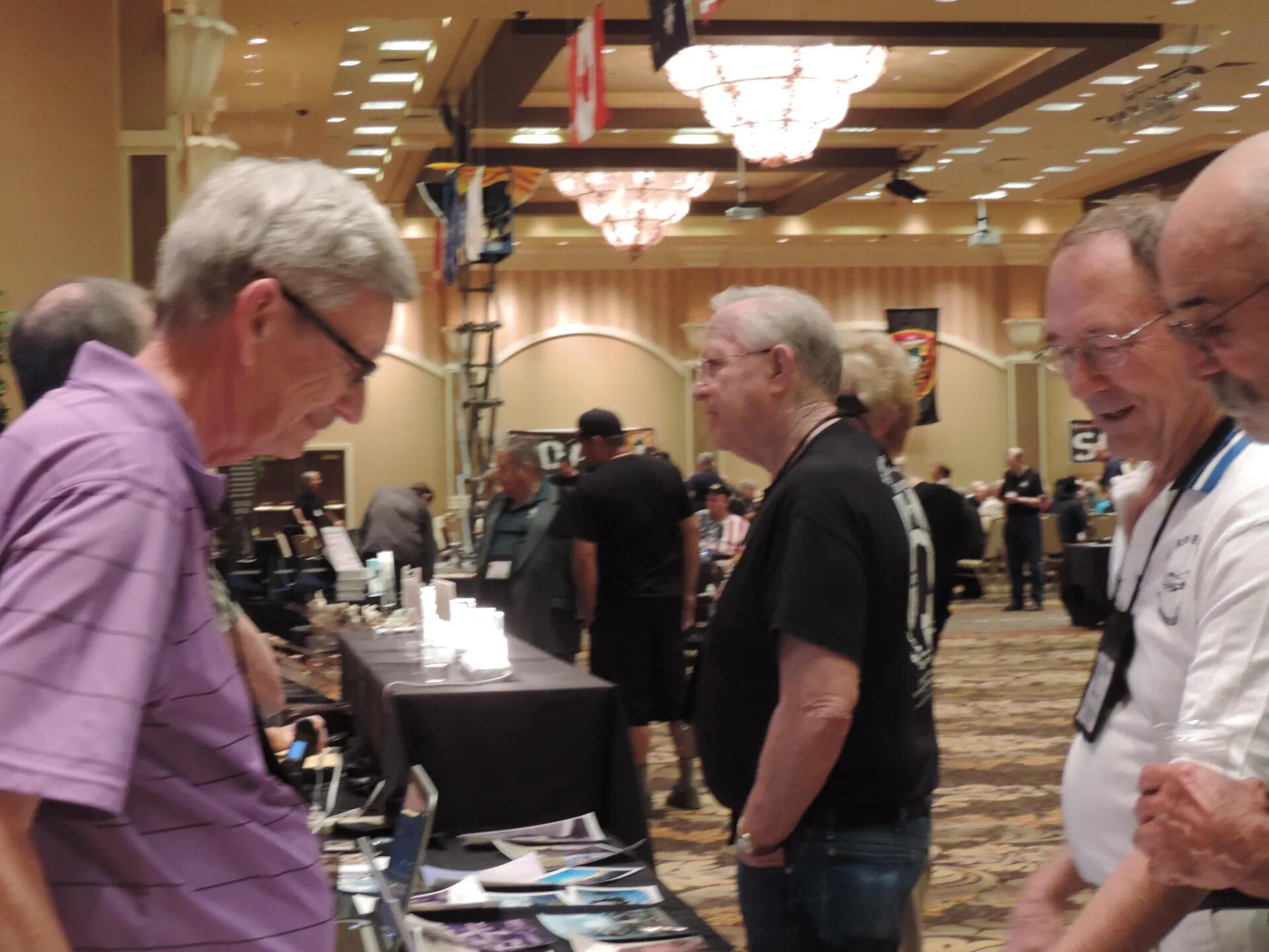 Members Moving Among the Display Tables Beneath the Ceiling Flags, Special Operations Association Reunion, Las Vegas, 2013