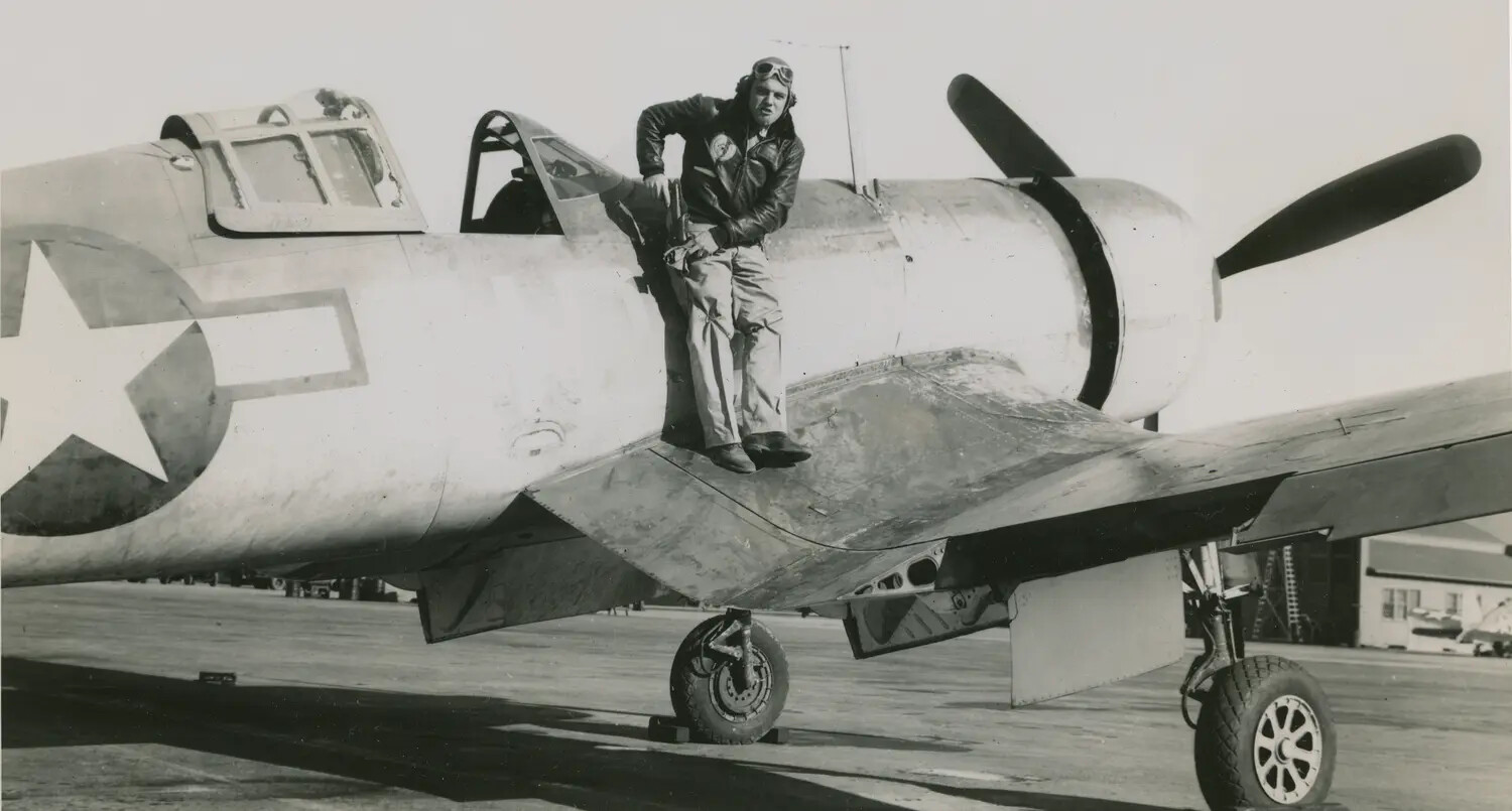 USAAF Fighter Pilot Posing on P-47 Thunderbolt Wing, WWII Era