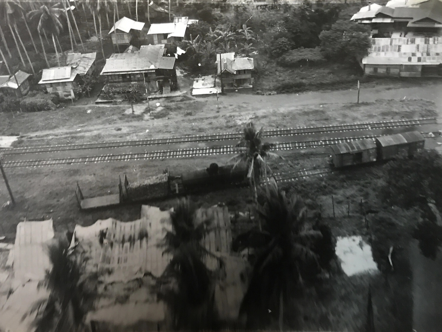 Low-Altitude Aerial Pass Over Philippine Rail Corridor and Village Rooftops