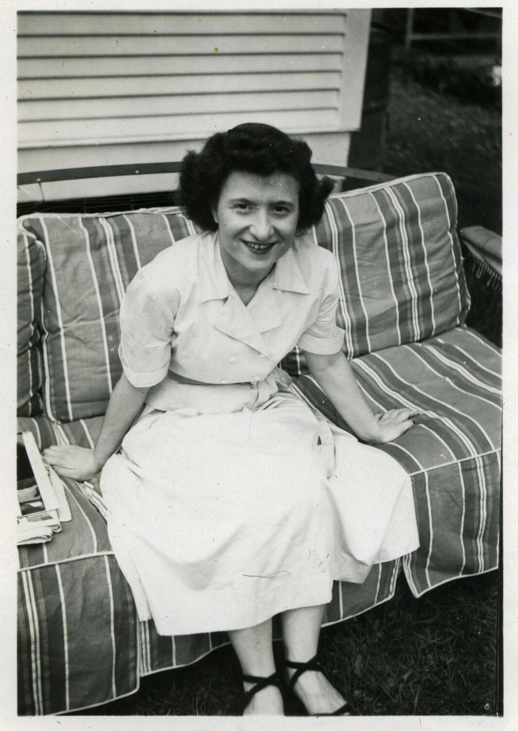 Portrait of a Young Woman on a Porch Glider, Korean War Era Home Front