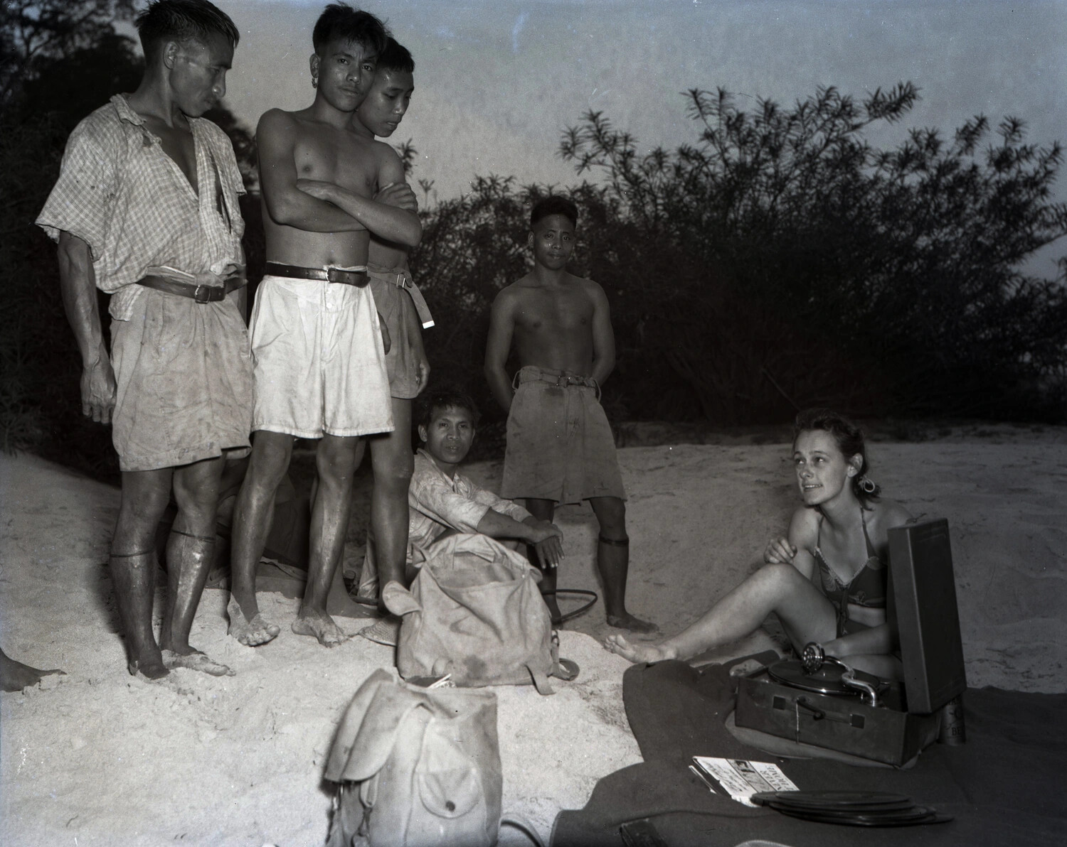 Western Woman with Portable Phonograph Surrounded by Local Villagers, China-Burma-India Theater, WWII Era