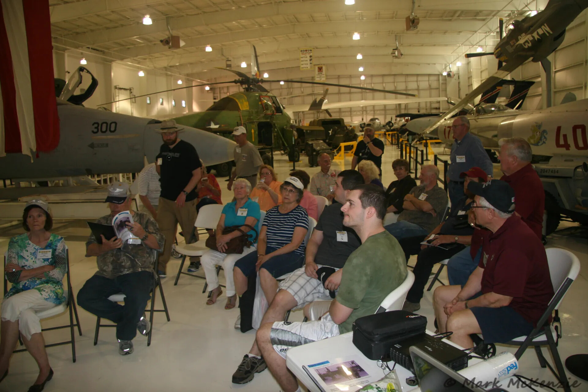 Reunion Attendees Attend a Presentation Inside an Aviation Museum Hangar, Operation Tailwind Reunion, April 30, 2016