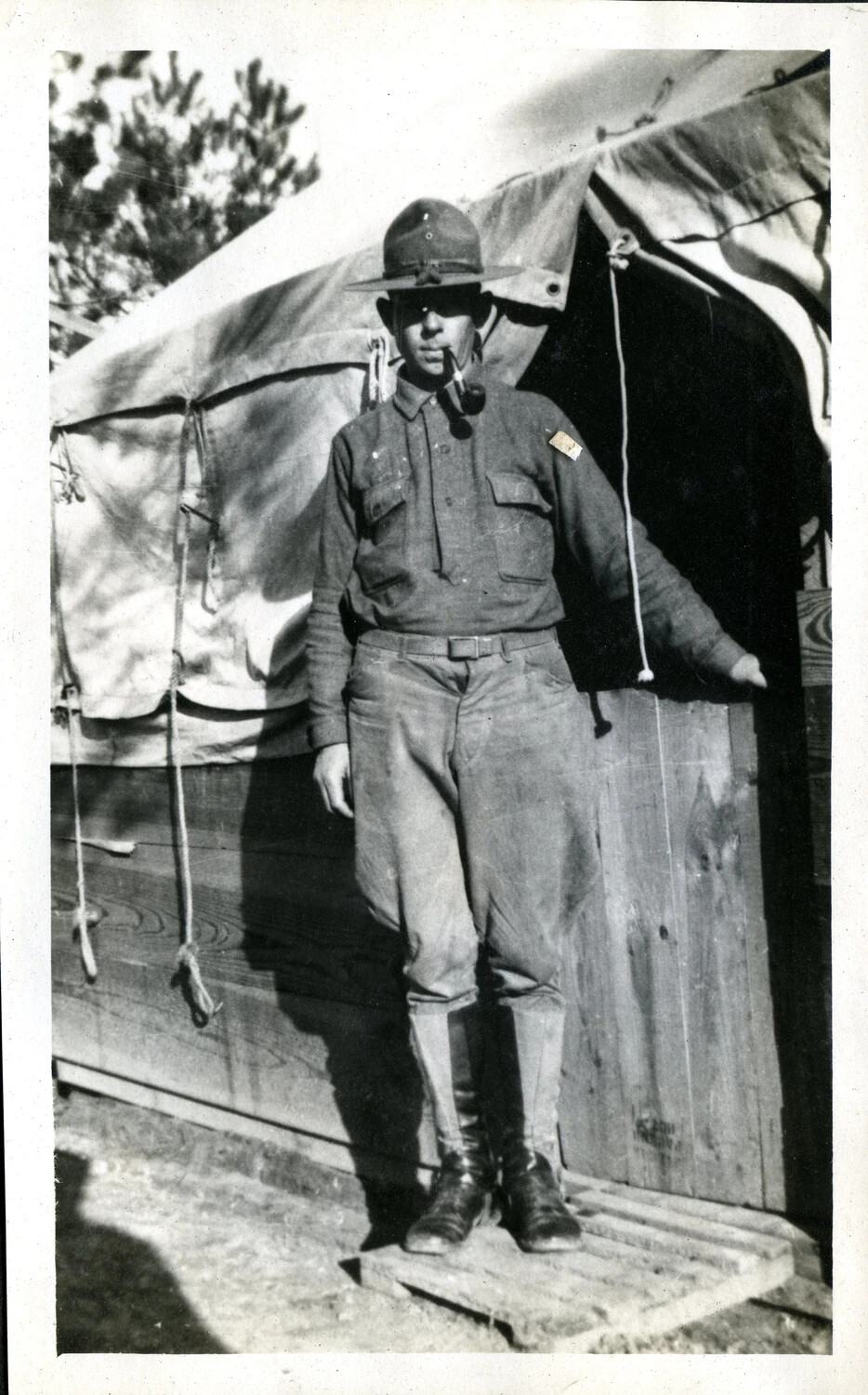 Portrait of a U.S. Army Soldier Smoking a Pipe at a Tent Doorway, WWI Training Camp