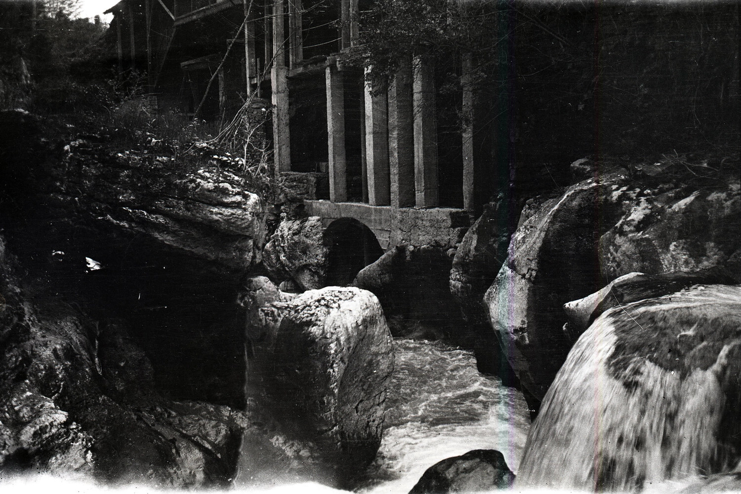 Wooden Structure on Stilts Above Rocky Mountain Stream, France, WWI Era