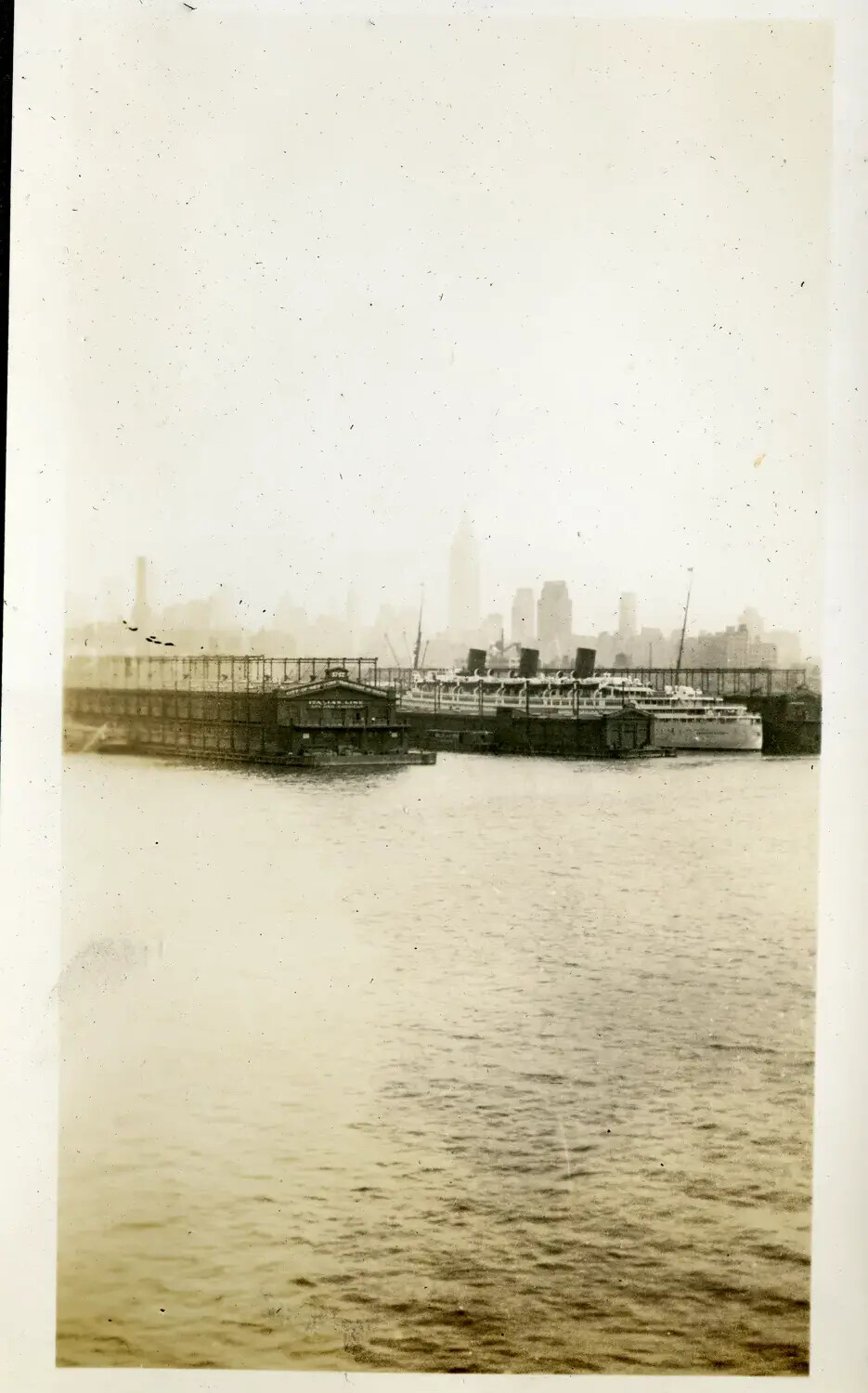 View of the Manhattan Waterfront and Italian Line Piers from Ship's Deck, New York Harbor, 1930s USS Maryland Photo Album