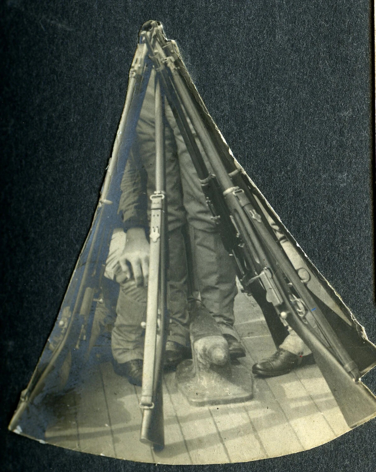 Stacked Rifles with Fixed Bayonets on Deck, USS Columbia Album (Trimmed Fan-Shaped Photograph)
