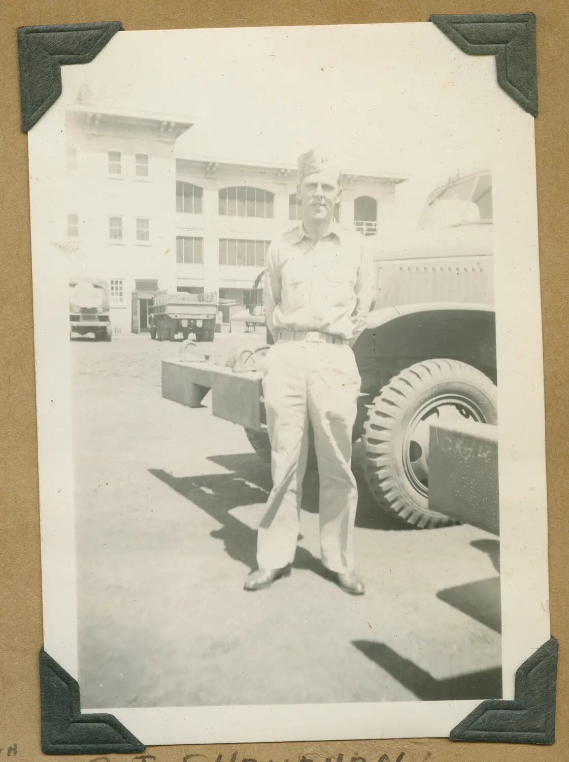 Portrait of a Serviceman with Military Cargo Trucks at a Hawaiian Army Post
