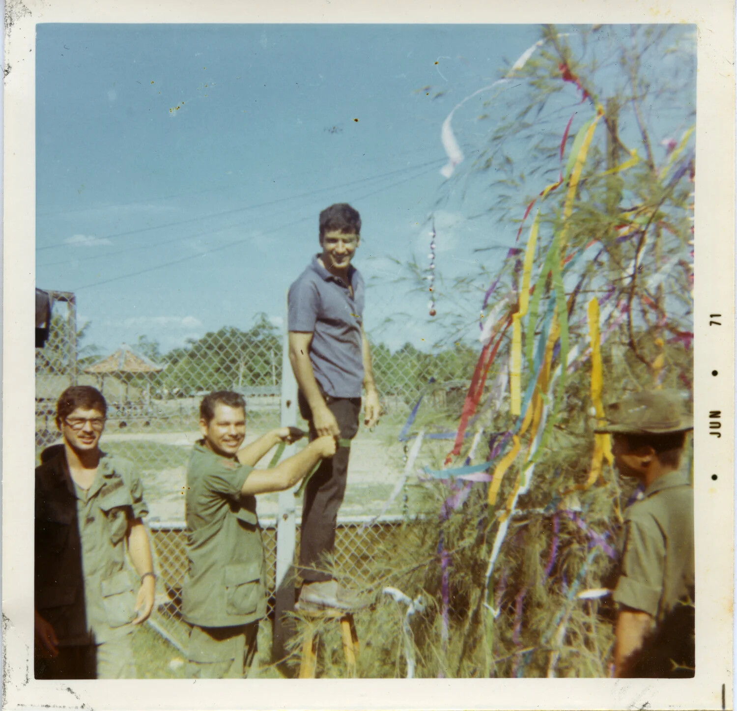 Servicemen Decorating a Makeshift Holiday Tree with Colored Streamers, Vietnam, 1971