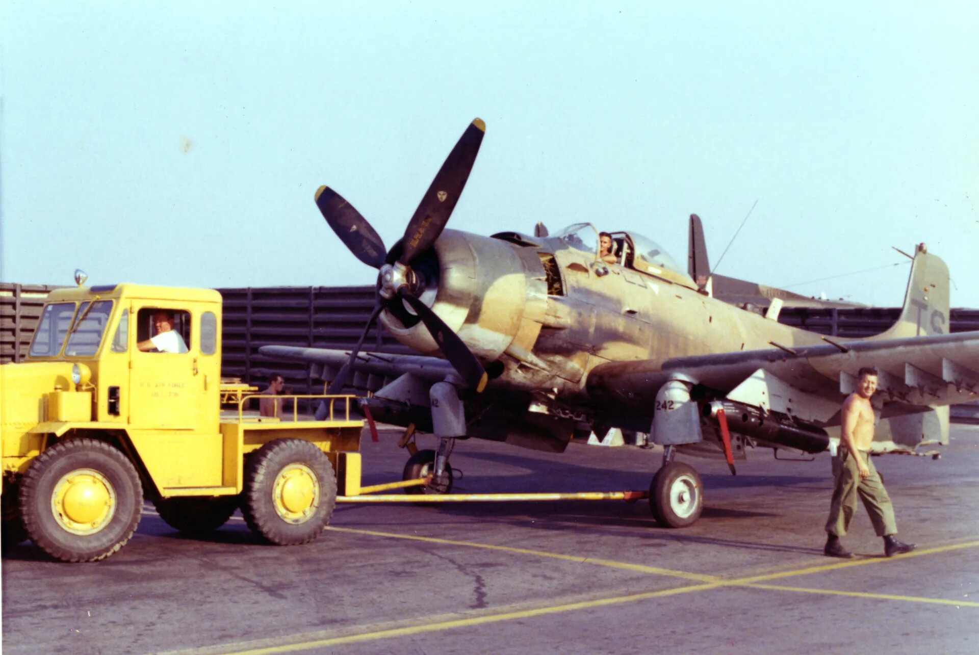 A-1 Skyraider No. 242 Under Tow, Vietnam Air Base (Restored Color)