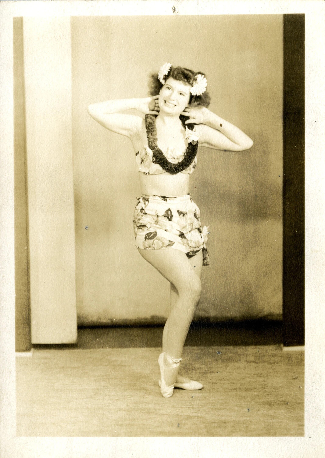 Studio Publicity Photograph of a Dancer in Floral Hula-Style Costume, WWII Era