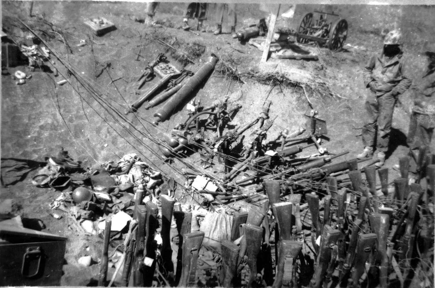 Captured Weapons Dump with Marine Sentry, Iwo Jima, 1945