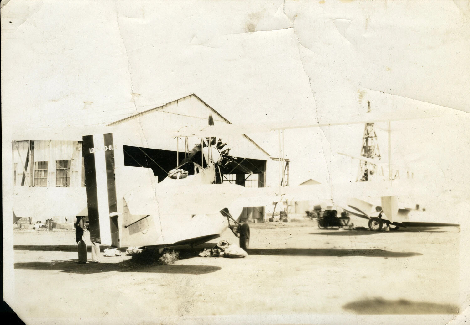 Loening OL-8 Amphibian Biplanes on Airfield Apron Before Hangar, U.S. Military Air Station