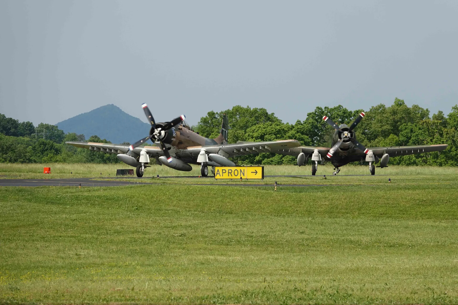 Two Douglas A-1 Skyraiders Taxiing Together at Airshow, May 2019