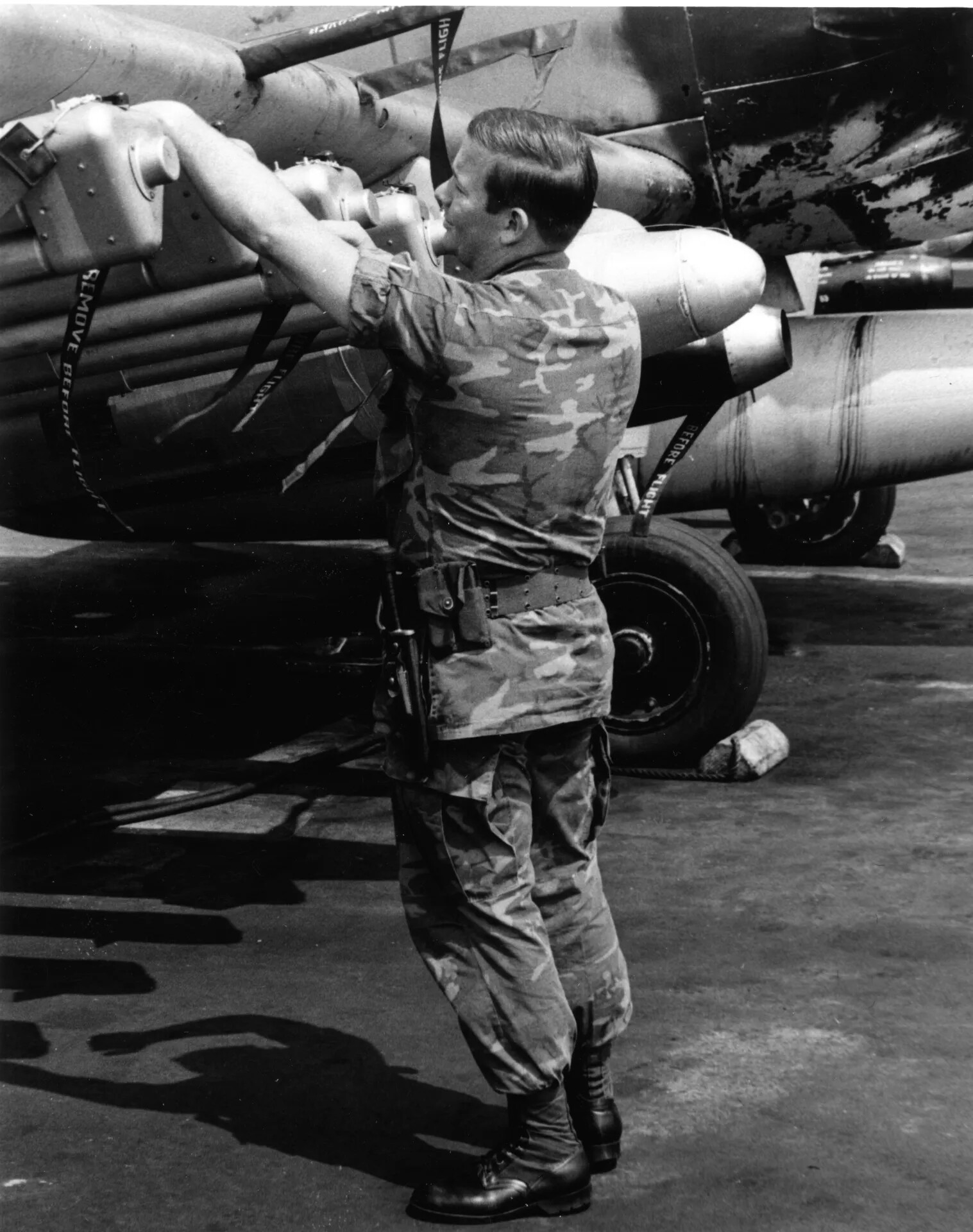 Airman Arming Rocket Pods on A-1 Skyraider, Vietnam War Flight Line