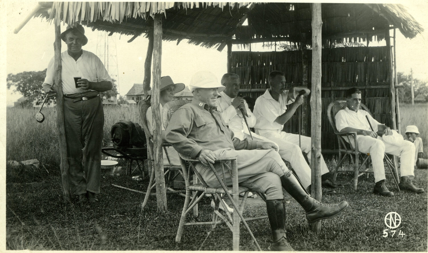 American Officers and Civilians at Leisure Under a Nipa Shelter, Philippines, Early 1900s