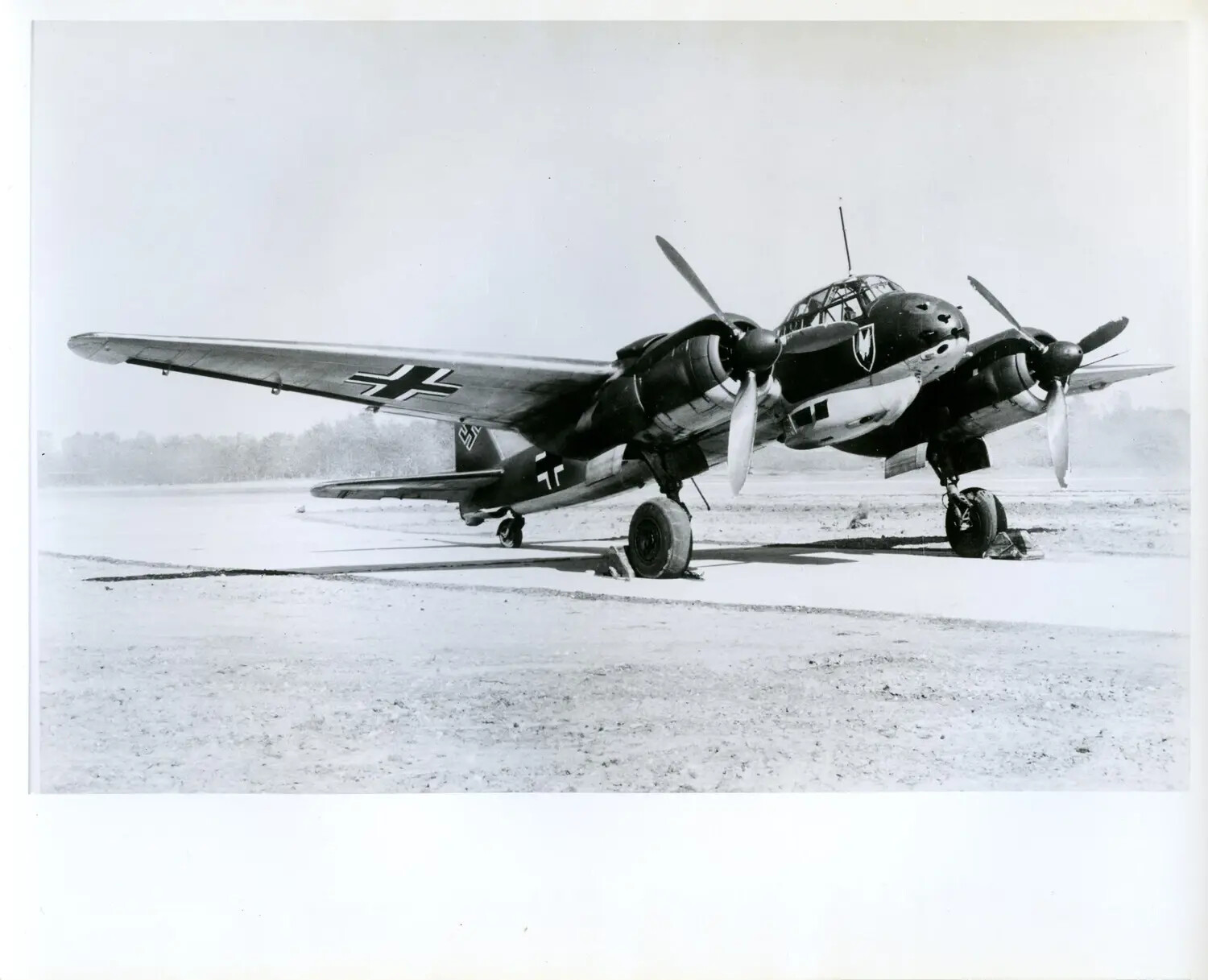 Captured Luftwaffe Twin-Engine Aircraft (Junkers Ju 88 Type) on Airfield, U.S. Evaluation Photograph, WWII Era