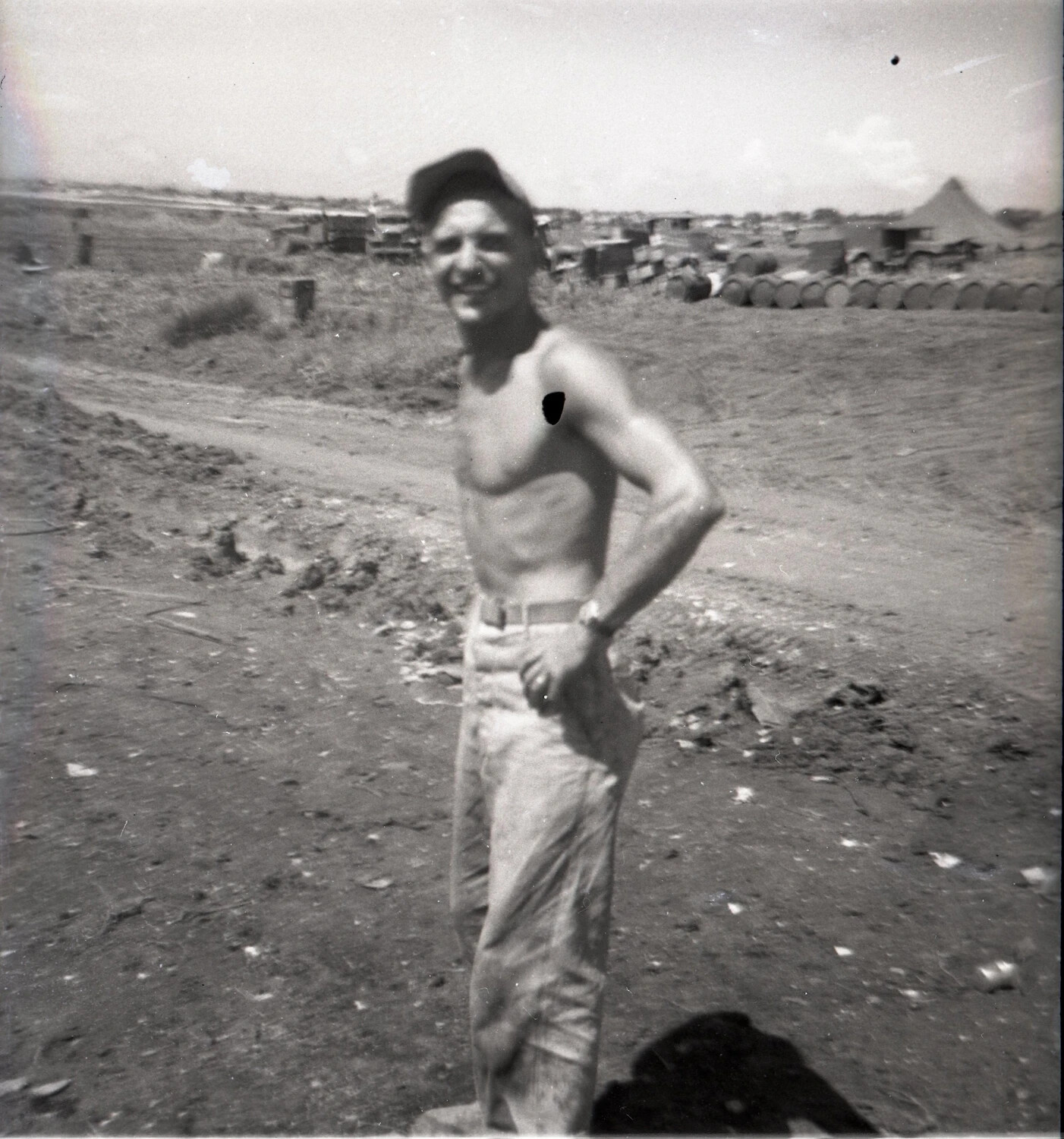 Portrait of Shirtless Serviceman at Supply Depot, WWII Pacific Air Base