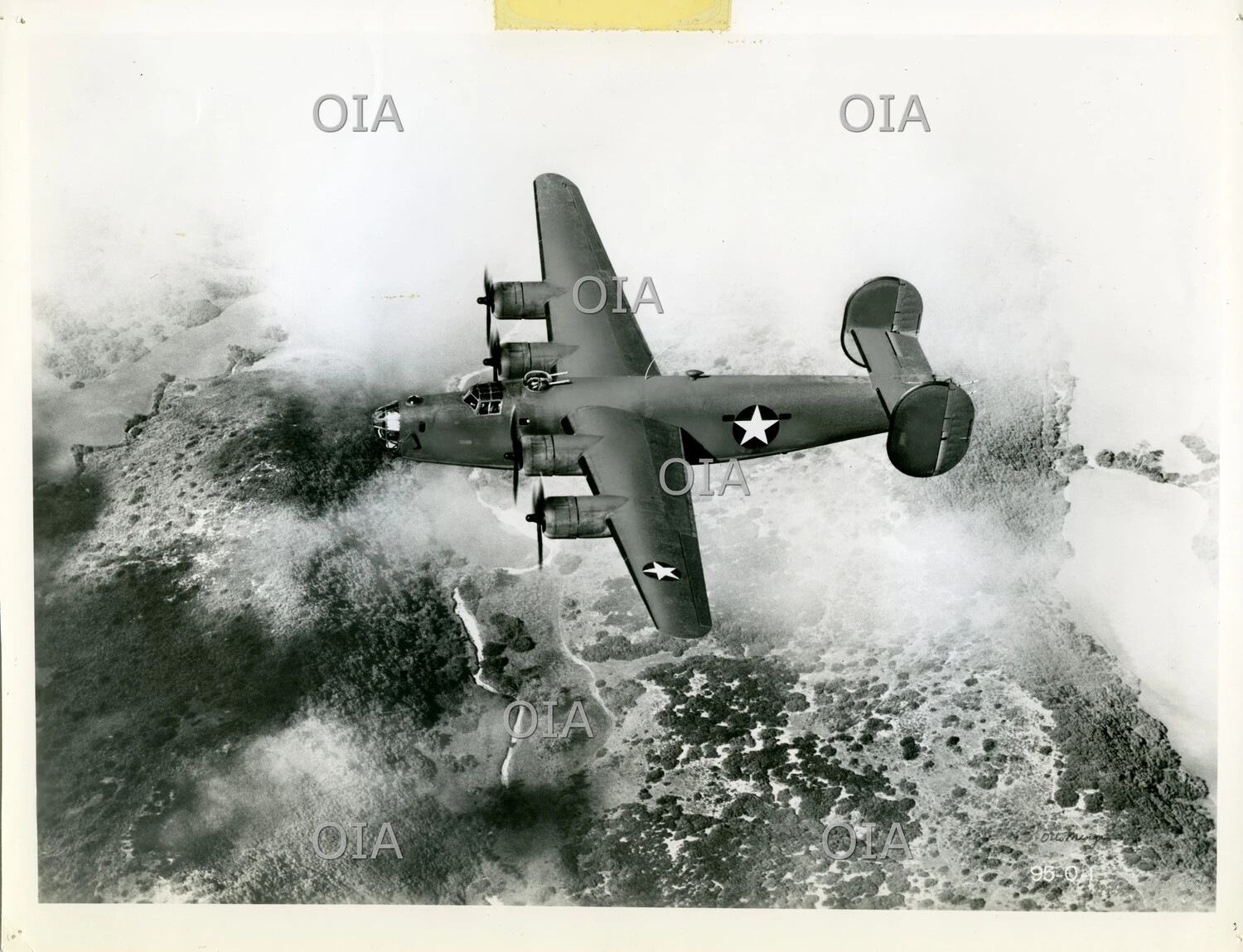 Consolidated B-24 Liberator in Flight Over Coastal Terrain
