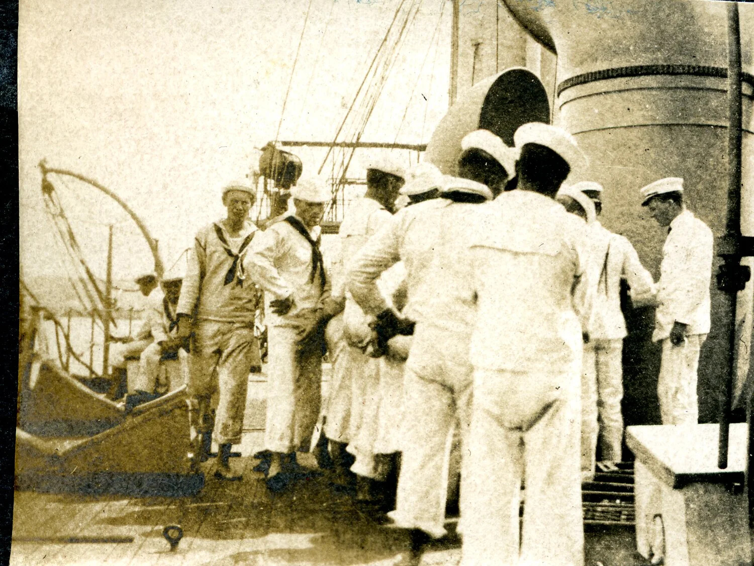 Sailors Gathered on Deck Near Funnel and Boat Davits, USS Columbia Album, c. 1898-1910s