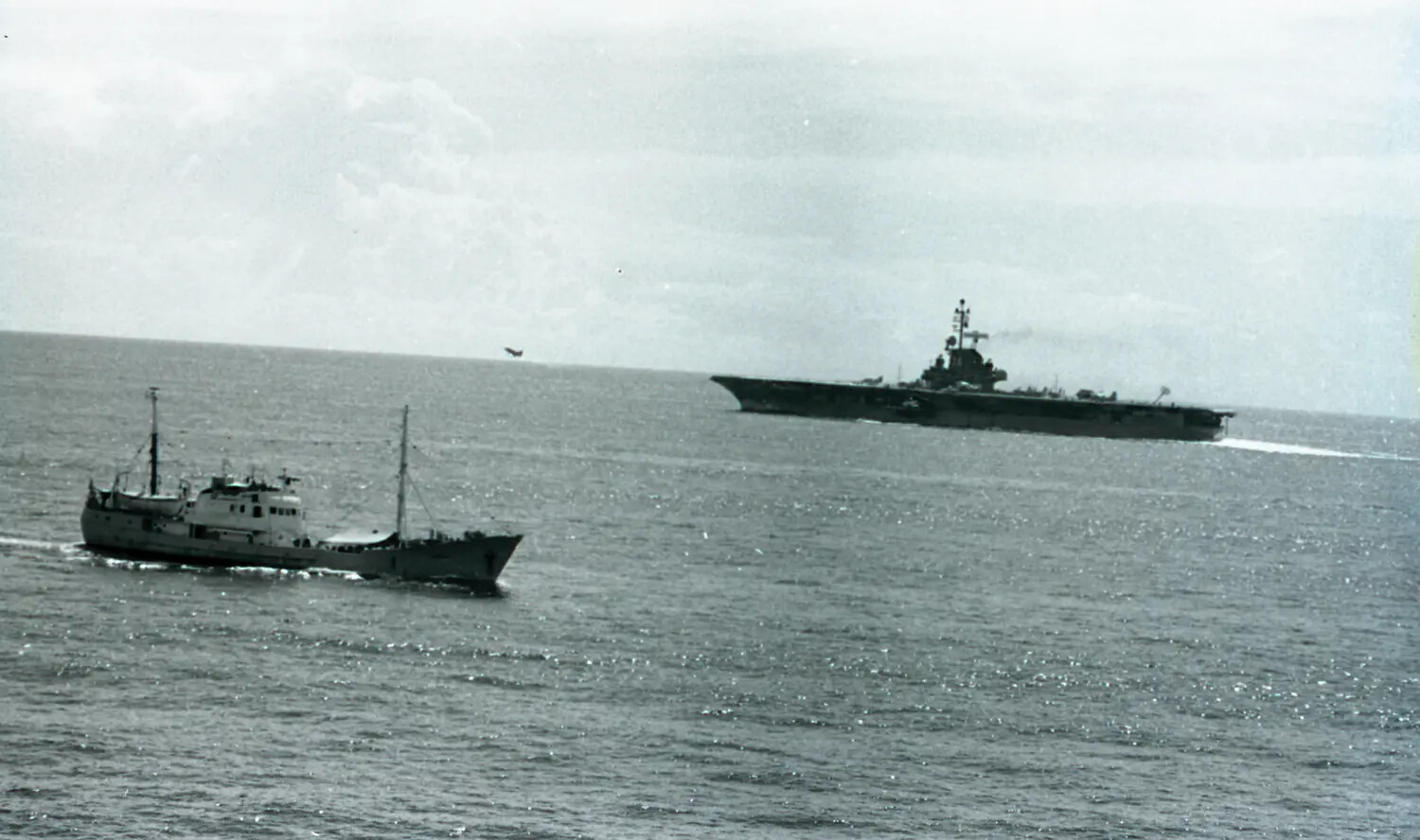 Soviet 'Ivan' Intelligence Trawler Shadowing USS Ticonderoga (CVA-14) at Sea, Vietnam War Era