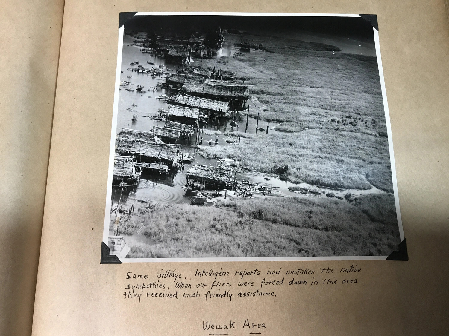 Album Page: Aerial View of Native Village with Handwritten Caption, Wewak Area, New Guinea