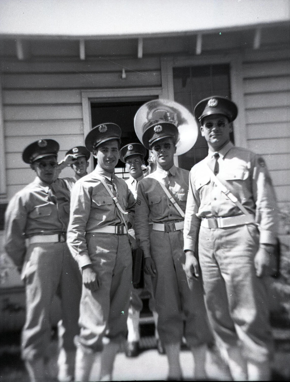 Group Portrait of Military Bandsmen with Sousaphone, Barracks Exterior