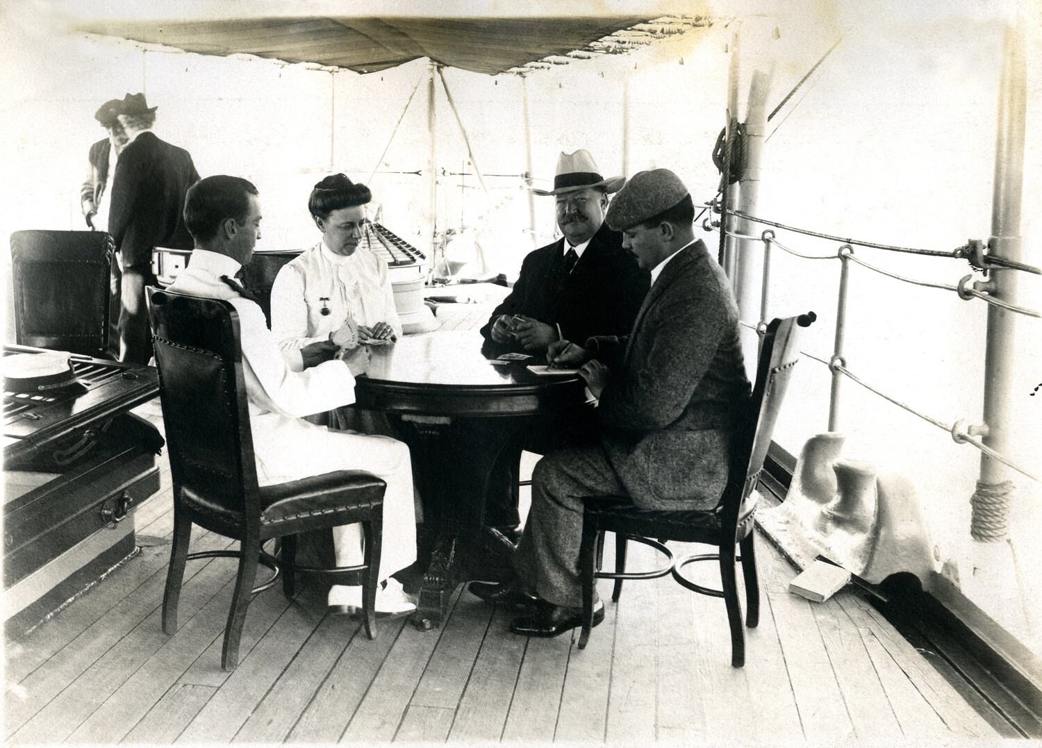 Detail View: 'A Social Hour at Bridge Whist' -- Secretary of War William Howard Taft and Party Aboard Ship, c. 1905-1908