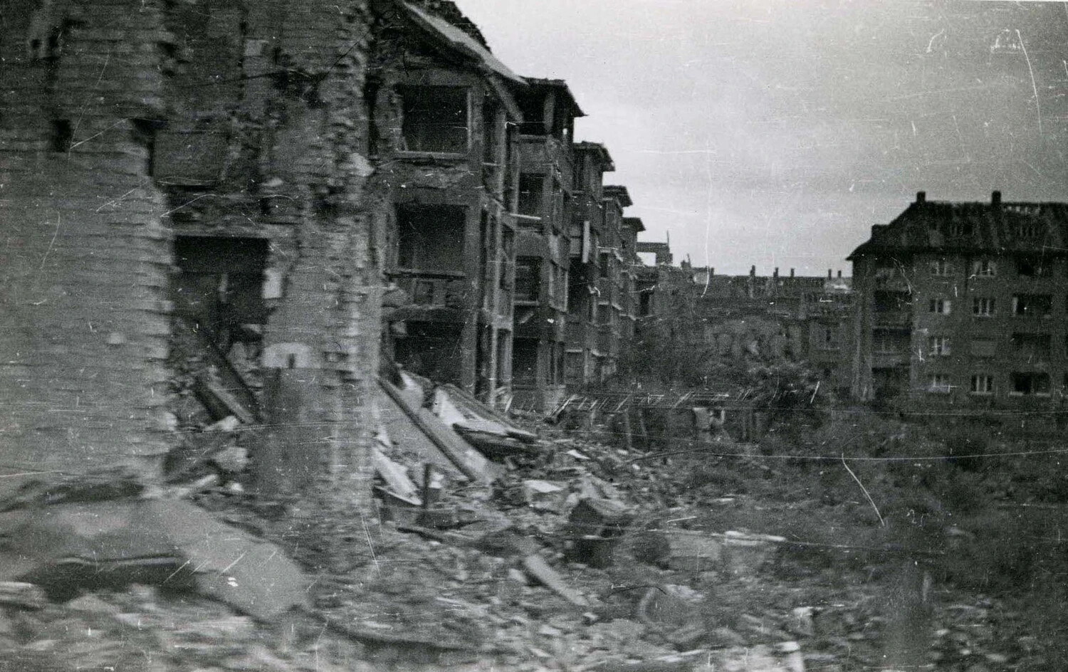 Bomb-Damaged Apartment Row with Rubble-Filled Street, WWII European Theater