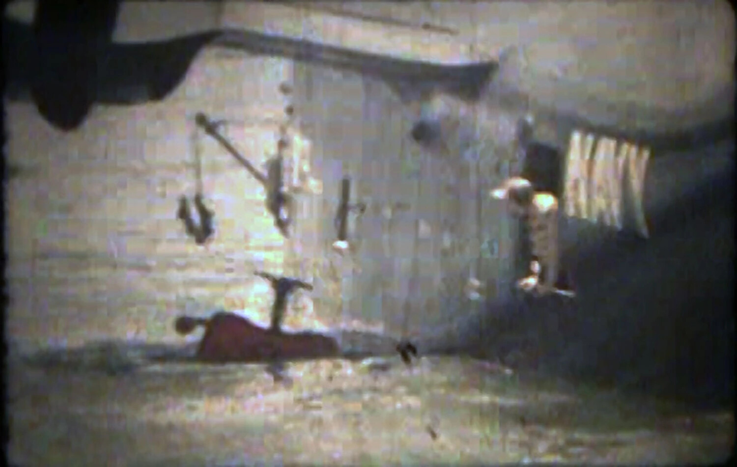 Video Still Frame: Workshop/Hangar Interior with 'NAVY' Markings, Joseph Smith Interview Footage (NAS Kaneohe)
