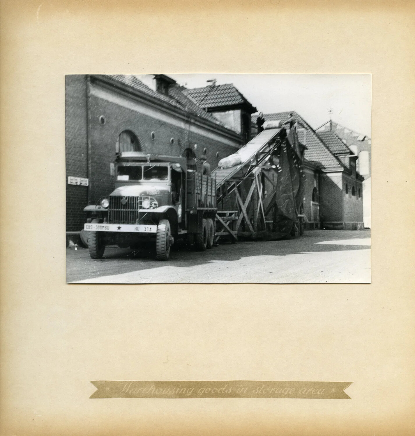 U.S. Army Cargo Truck Loading Supplies at a German Depot Warehouse