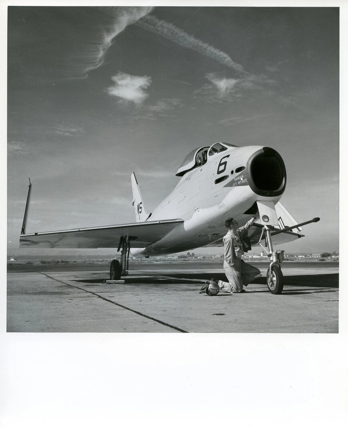 U.S. Navy Jet Fighter (Grumman F9F Panther-type), Tail Code 'WS,' No. 6, with Ground Crewman
