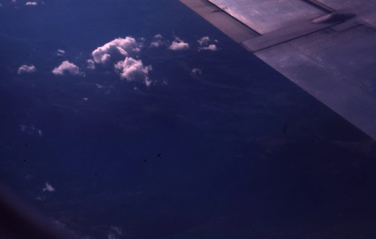Aerial View from Aircraft Window with Wing, Vietnam War Era Transit Flight