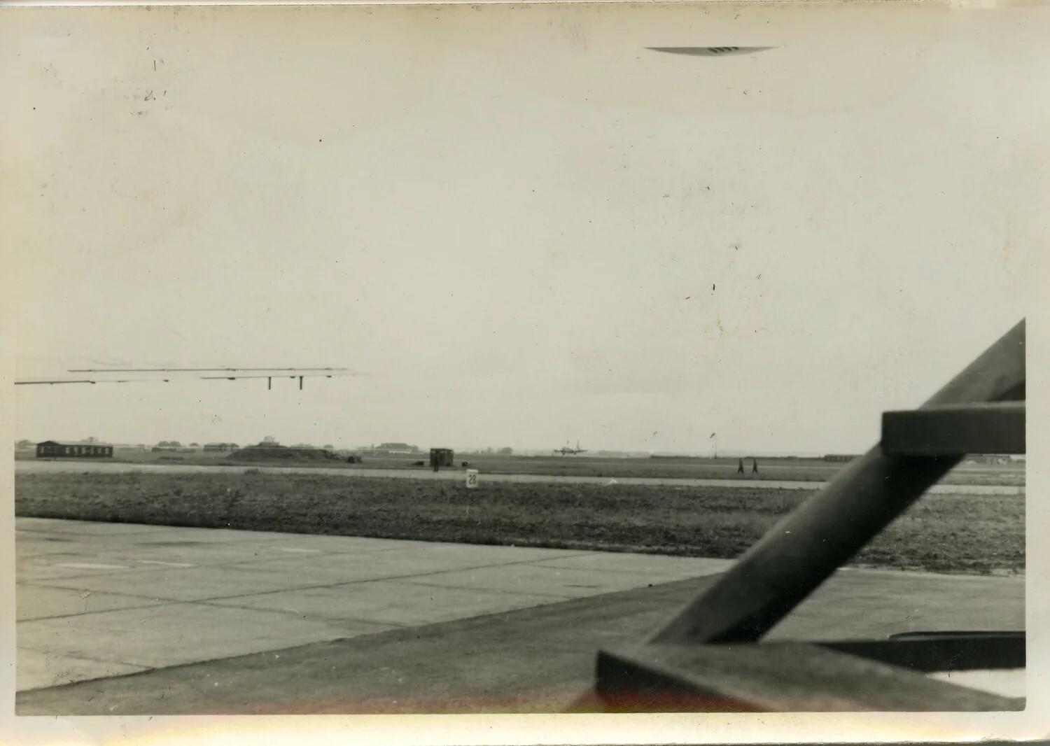 Runway View with Threshold Marker '28' and Distant Aircraft, USAF Airfield