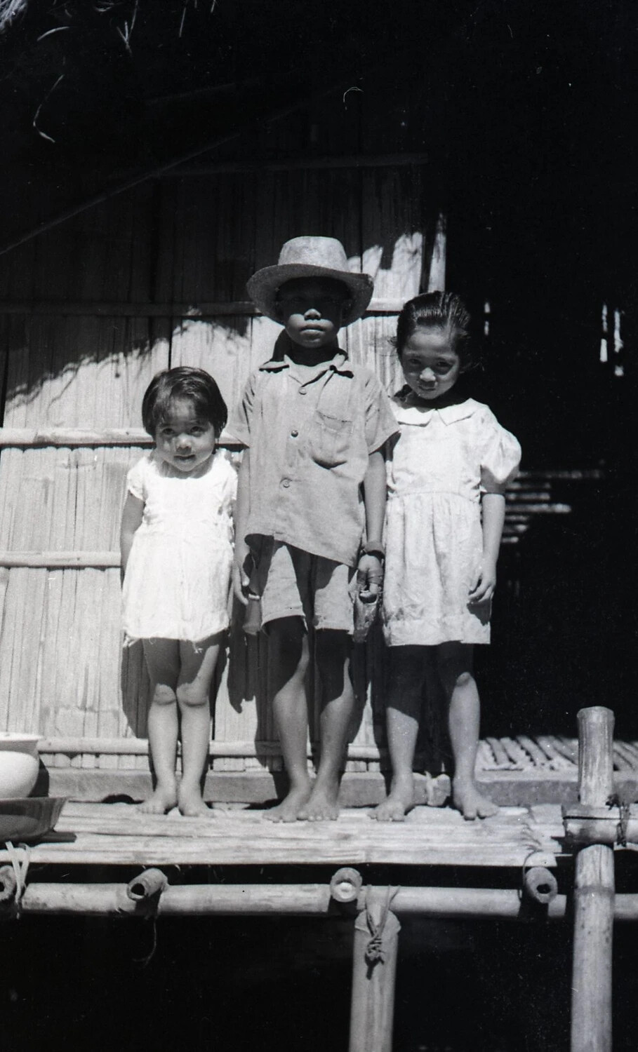 Three Filipino Children with Boy in Straw Hat, Luzon, Philippines, WWII Era